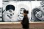 Les photos de jeunes de Clichy-sous-Bois, prises par JR, habillent un mur de la ville un an aprs le dbut des meutes de banlieue. | AP/CHRISTOPHE ENA